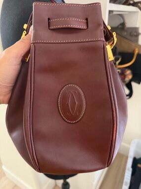 Cartier Burgundy Leather Drawstring Crossbody with Gold-Tone Hardware